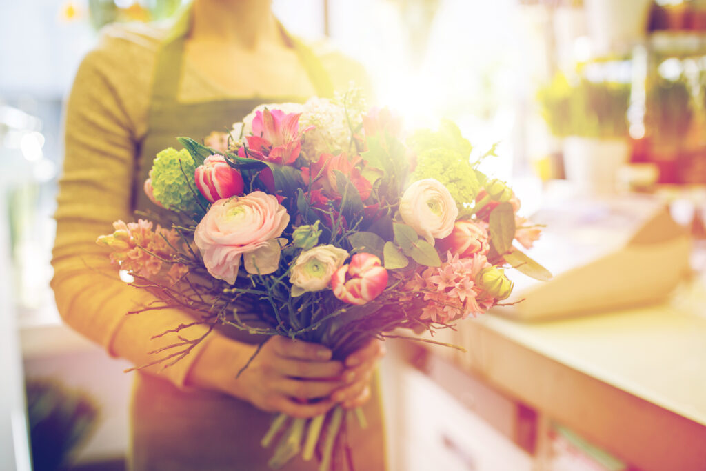 image of woman holding flowers