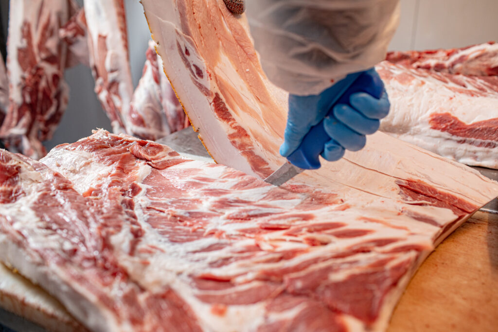 image of butcher cutting ribs